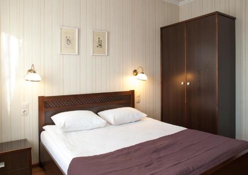 Postel nebo postele na pokoji v ubytování Hotel Persona