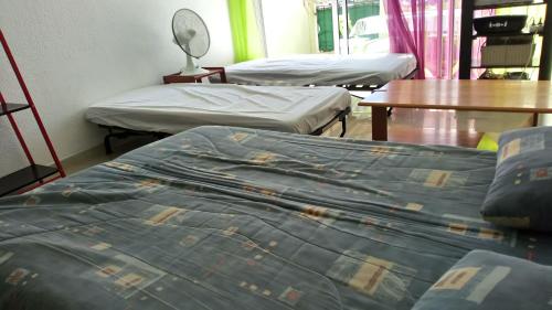 Ένα ή περισσότερα κρεβάτια σε δωμάτιο στο Residence Acapulco