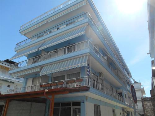 a tall building with balconies on the side of it at VILLA HARIKLIA in Paralia Katerinis