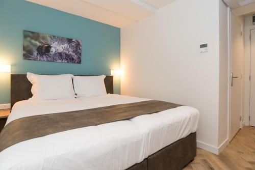 Postel nebo postele na pokoji v ubytování Hof van Holland Hotel