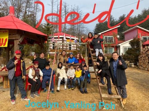 a group of people posing for a picture on a playground at Heidi Korea in Hongcheon