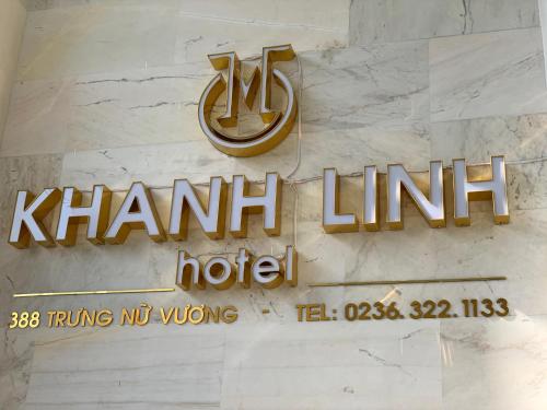 a sign for a hants inn hotel on a wall at Khanh Linh Hotel in Da Nang