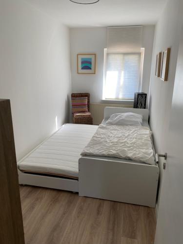 Postel nebo postele na pokoji v ubytování Gästeapartement Markkleeberg