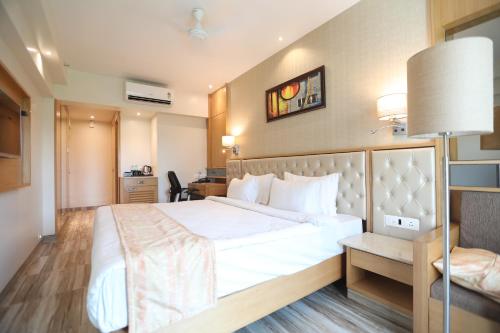 Postel nebo postele na pokoji v ubytování Hotel Cliffton