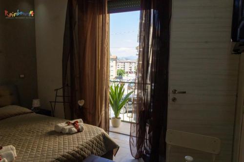 a bedroom with a bed and a window with a view at Residenza Montenevoso in Campobasso