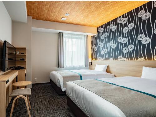 Cama o camas de una habitación en Tosei Hotel Cocone Asakusa Kuramae