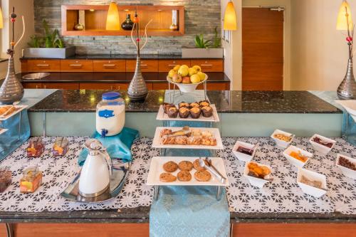 a table with different types of food on it at Town Lodge Roodepoort in Roodepoort