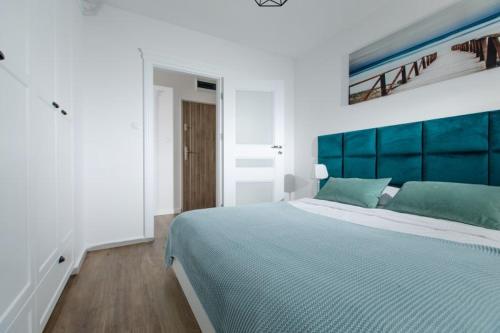 Postel nebo postele na pokoji v ubytování Resort Apartamenty Klifowa Rewal 36