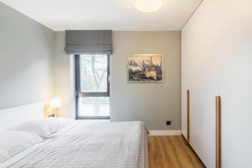 Katil atau katil-katil dalam bilik di Victoria Residence Apartments by Grand Apartments