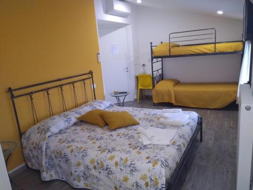 Postel nebo postele na pokoji v ubytování B&B NONO TILIO