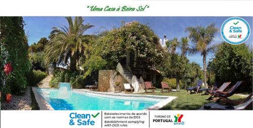 a picture of a swimming pool at a house at Uma Casa a Beira Sol in Lagos