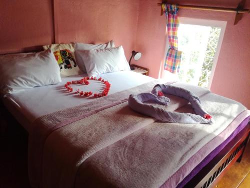 a child laying on a bed in a bedroom at Sincere Wilderness Home stay in Nuwara Eliya