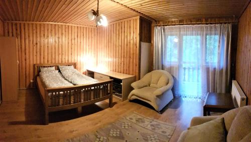 Postel nebo postele na pokoji v ubytování Domek pod Kłódką