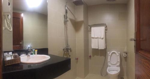 a bathroom with a sink and a toilet at Anise hotel in Phu Quoc