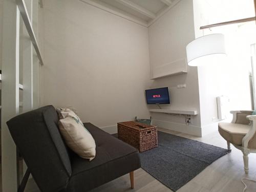 Et tv og/eller underholdning på Apartamento Loft-Cambados