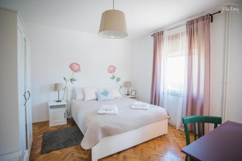 Posteľ alebo postele v izbe v ubytovaní Vila Ema