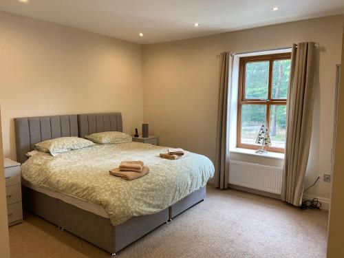 מיטה או מיטות בחדר ב-Nab View Cottage