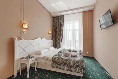 Postel nebo postele na pokoji v ubytování Hotel Levitan