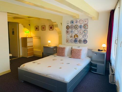 Posteľ alebo postele v izbe v ubytovaní Amsterdam Central Guest House