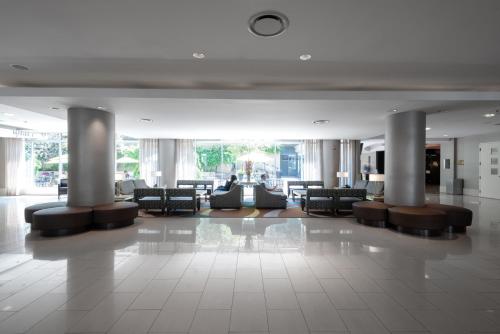 a lobby with couches and chairs in a building at Holiday Inn Washington Capitol-National Mall by IHG in Washington