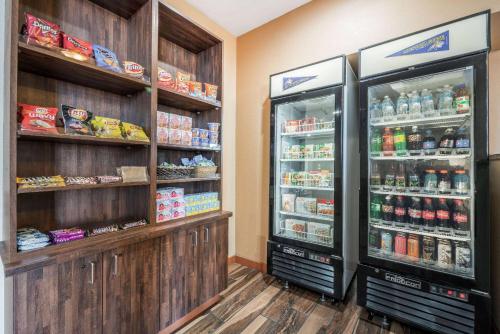 a store with two refrigerators in a room at La Quinta by Wyndham Belgrade - Bozeman Airport in Belgrade