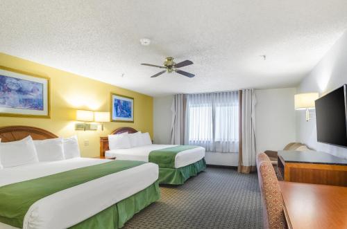 Säng eller sängar i ett rum på Cheyenne Guest Inn