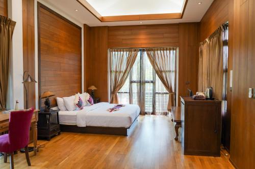 Giường trong phòng chung tại Risasinee Spa & Resort