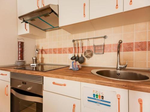 a kitchen with a sink and a counter top at Casa Aloe in Corralejo