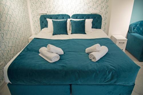Ένα ή περισσότερα κρεβάτια σε δωμάτιο στο All Seasons Apartments