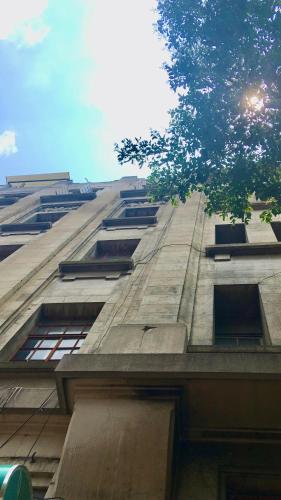 a tall building with windows on the side of it at Massiosare El Hostal in Mexico City