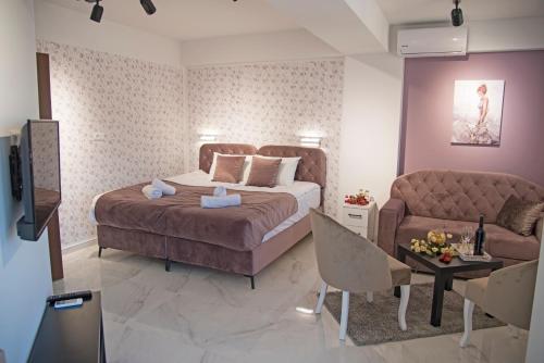 Ένα ή περισσότερα κρεβάτια σε δωμάτιο στο All Seasons Apartments