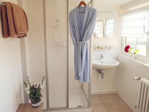 a bathroom with a shower and a sink at Pension Bauer in Ebern