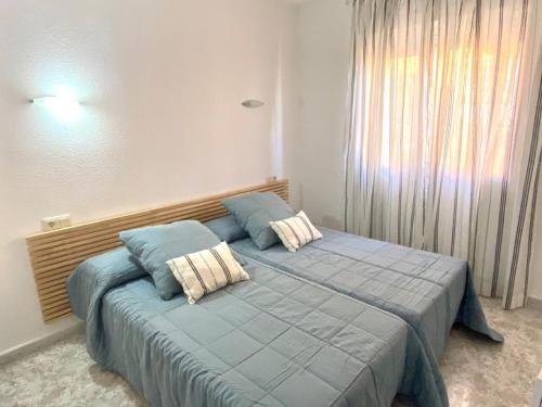 Ліжко або ліжка в номері Fantástico apartamento con vistas panorámicas al mar