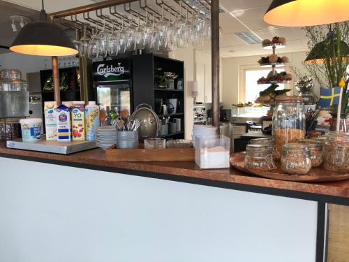 a kitchen counter with food items on top of it at Marinan Richters in Fjällbacka