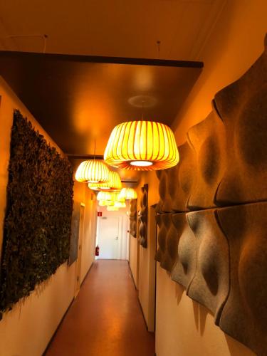 a hallway with several lights on a wall at Marinan Richters in Fjällbacka