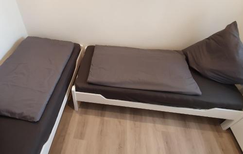 a small room with two beds in it at Ferienwohnung Strandjuwel am Strand in Norddeich