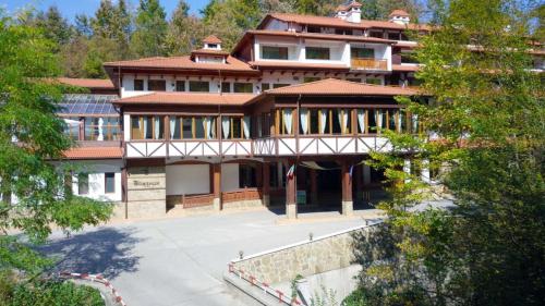 a large building with a lot of windows at Hotel Bozhentsi in Chernevtsi