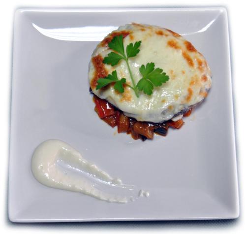 a plate of food with an egg on top at Pensión San Marcos in Arcos de la Frontera