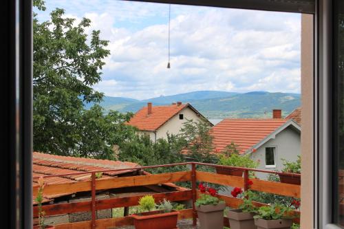 a view from the window of a house with plants at Apartmani Ilić in Golubac