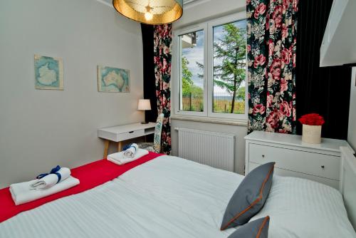 Łóżko lub łóżka w pokoju w obiekcie BlueApart Apartamenty Nexo