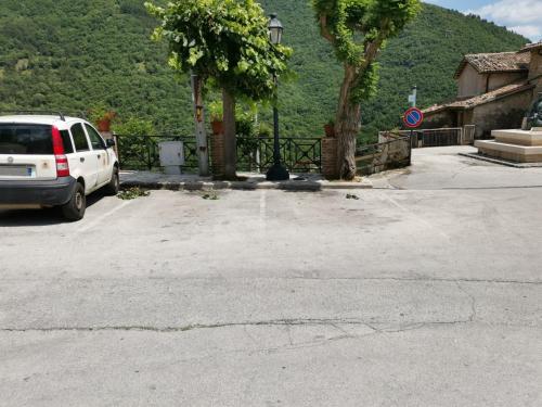 a white van parked in a parking lot at Il Torrione in Poggio Bustone