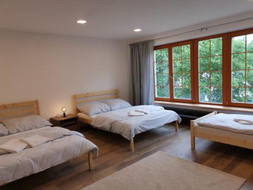 מיטה או מיטות בחדר ב-Chalupa U Potoka