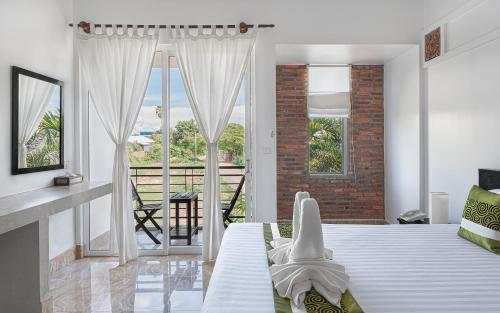 Ένα ή περισσότερα κρεβάτια σε δωμάτιο στο Villa Agati