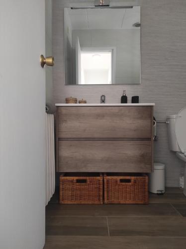 a bathroom with a sink and a mirror at Casa Palau - Relax y naturaleza a los pies del Montseny Arbúcies in Arbúcies