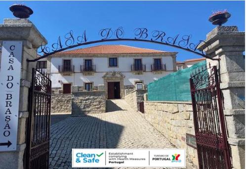 an entrance to a building with an iron gate at Casa Do Brasao in Tabuaço