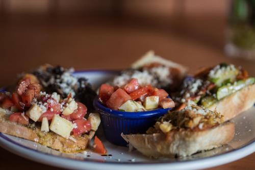 a plate of food with a sandwich and a bowl of fruit at Park Hotel in Santa Cruz Verapaz