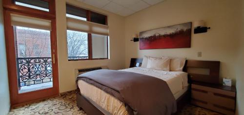 a bedroom with a bed and a window at Lowell Inn in Stillwater