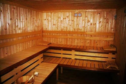 a wooden sauna with two benches in it at Villa Tino in Ohrid