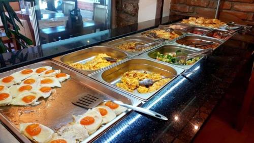 a buffet line with many different types of food at Villa Tino in Ohrid