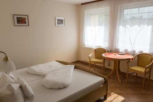 Postel nebo postele na pokoji v ubytování Hotel Harka